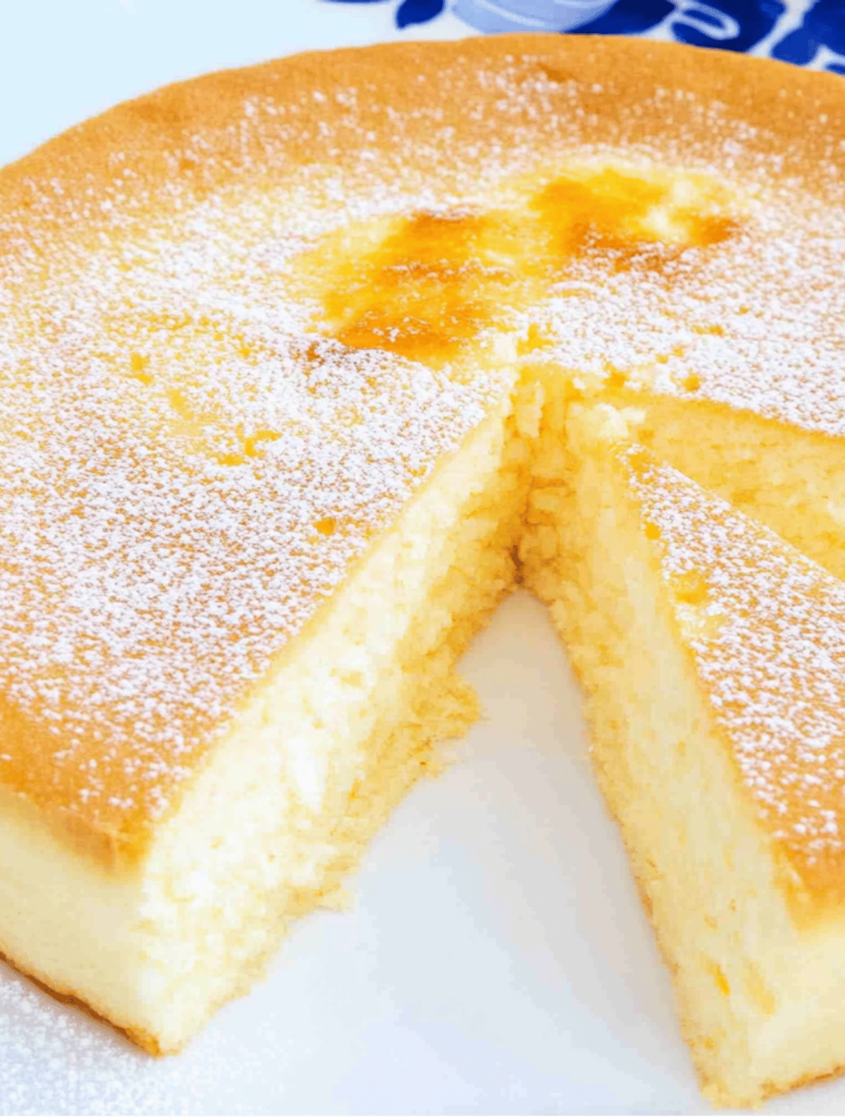 Golden cloud cake with powdered sugar and soft crumb
