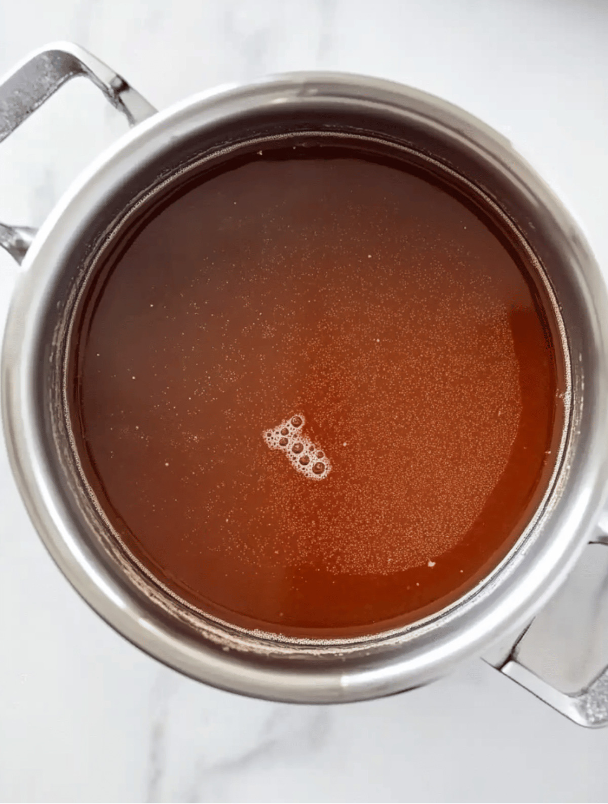 apple pie moonshine base simmering in pot