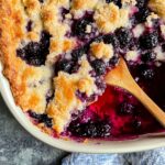 Blackberry Cobbler Recipe That’s Quick, Cozy & Packed With Flavor 2 Top-down view of baked blackberry cobbler in ceramic pan