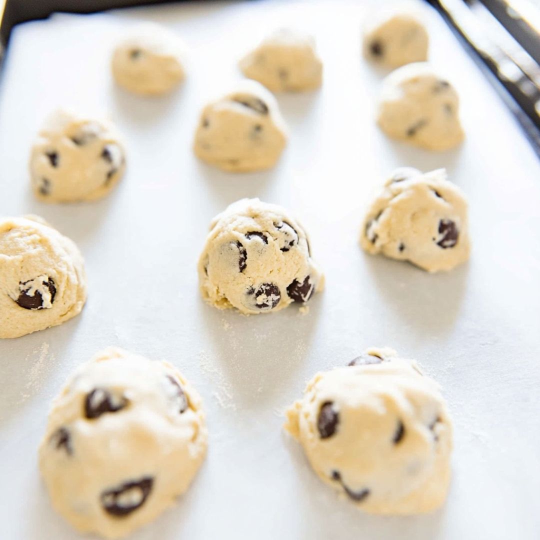 toll house cookie dough balls on baking tray ready to bake