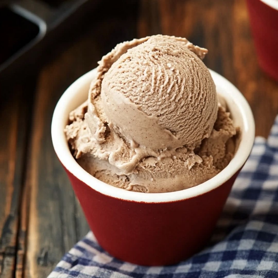 Homemade Dr Pepper Ice Cream in Red Cup Single scoop of homemade Dr Pepper ice cream in red cup