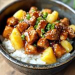 Pineapple chicken and rice with golden pineapple and sesame seed topping