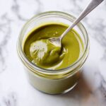 Pistachio Butter Recipe: How to Make and Use This Rich, Nutty Spread 2 Smooth pistachio butter in a jar on marble background