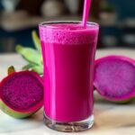 Bright purple weight loss drink made with dragon fruit and served in a glass